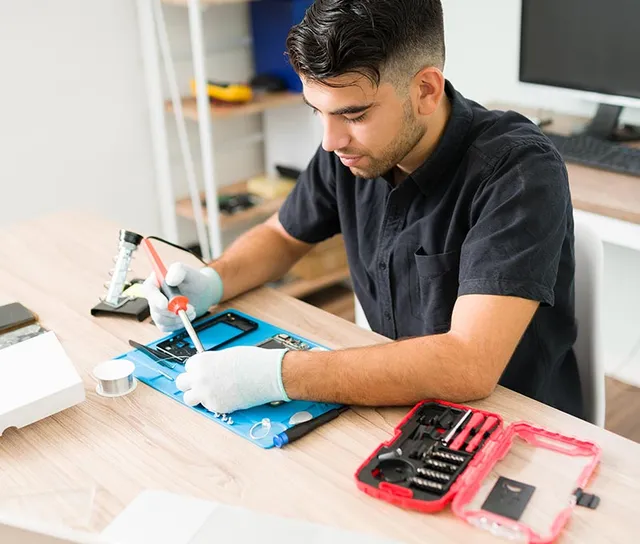 Inside a URPhone Store repair workspace in Orlando