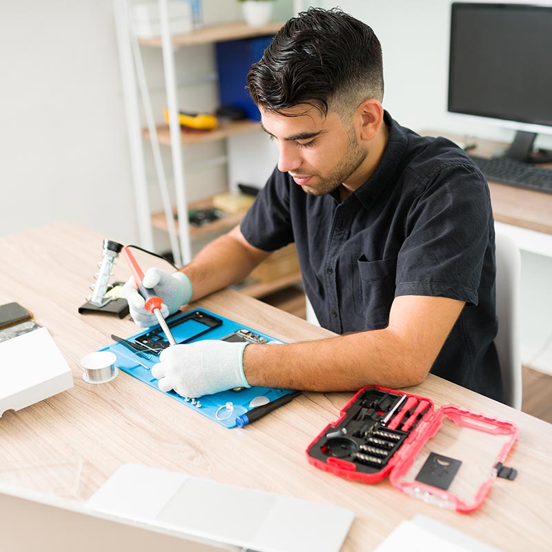 URPhone Store technician repairing a Xiaomi phone in Orlando